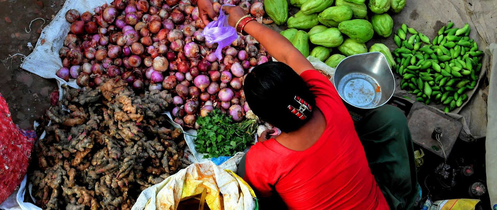 A women selling vegetables at a shop
