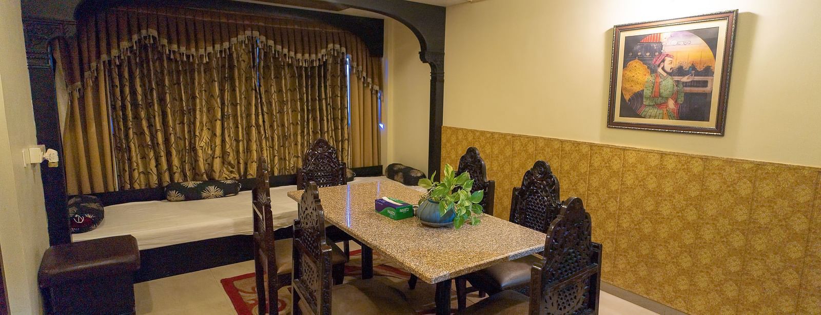 Queen Room featuring a seperate living area with dining setup. - Hotel Ashok Nagpur