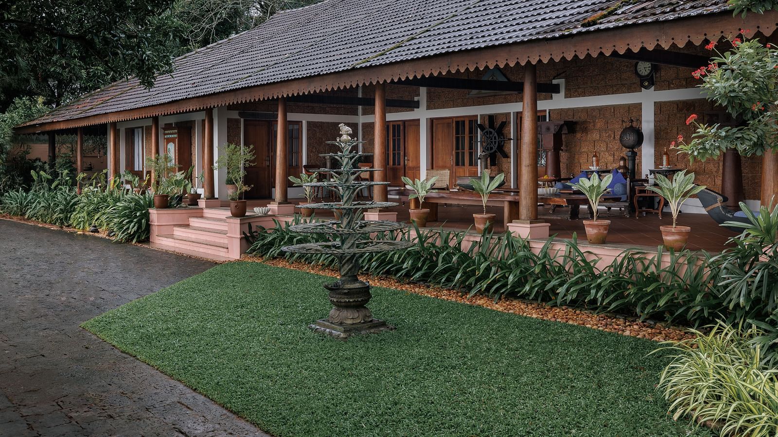 A facade of BluSalzz Villas - Muhamma Resort, Alleppey featuring the villas and greenery around it