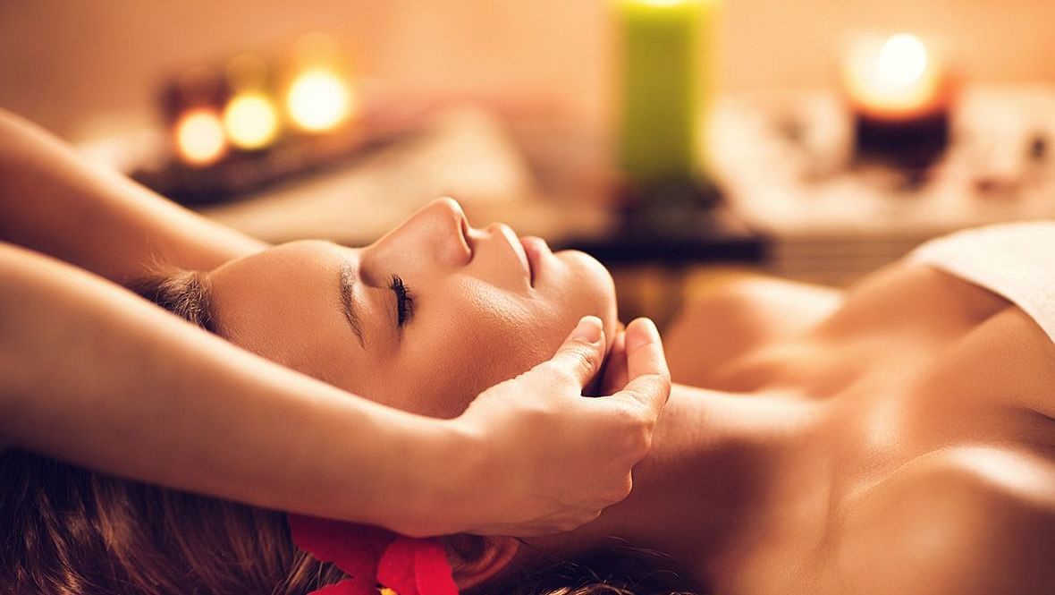 Image of a lady receiving facial in a spa.