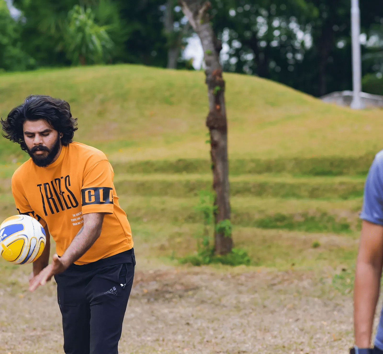 A boy playing with the ball near the Avana Resort