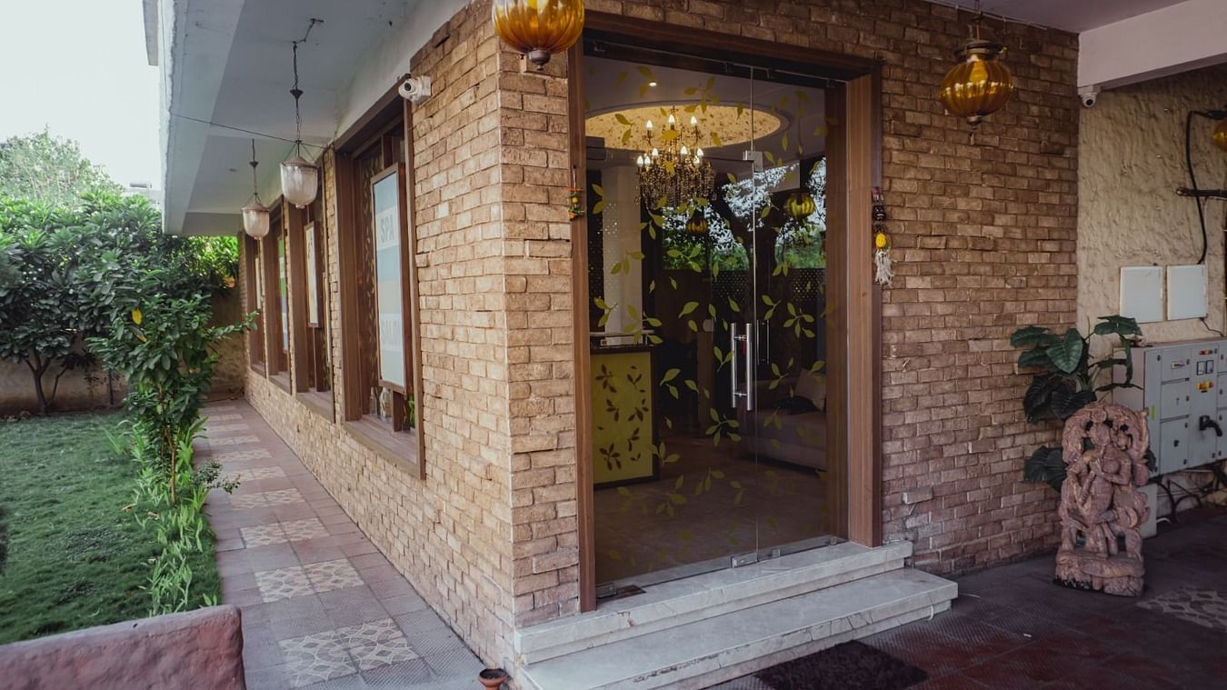 Image of a entrance of IOSIS Spa & Wellness Raipur surrounded by greenery