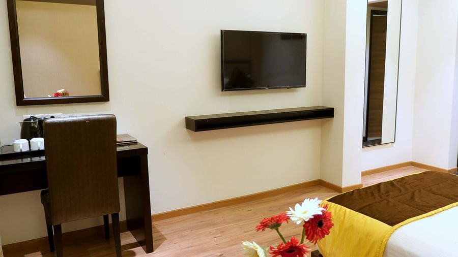 view of TV and work desk of Premium Twin Room of ASR Parklane, Hosur