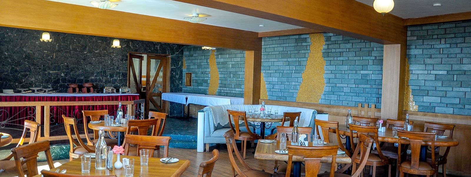 an elaborate seating arrangement at our multi-cuisine restaurant at La Montana By TGI, Ooty