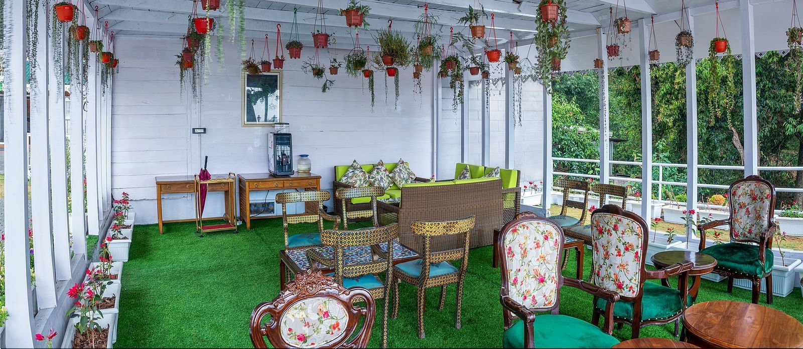 Open-air restaurant seating arrangement at Summit Barsana Resort & Spa, Kalimpong