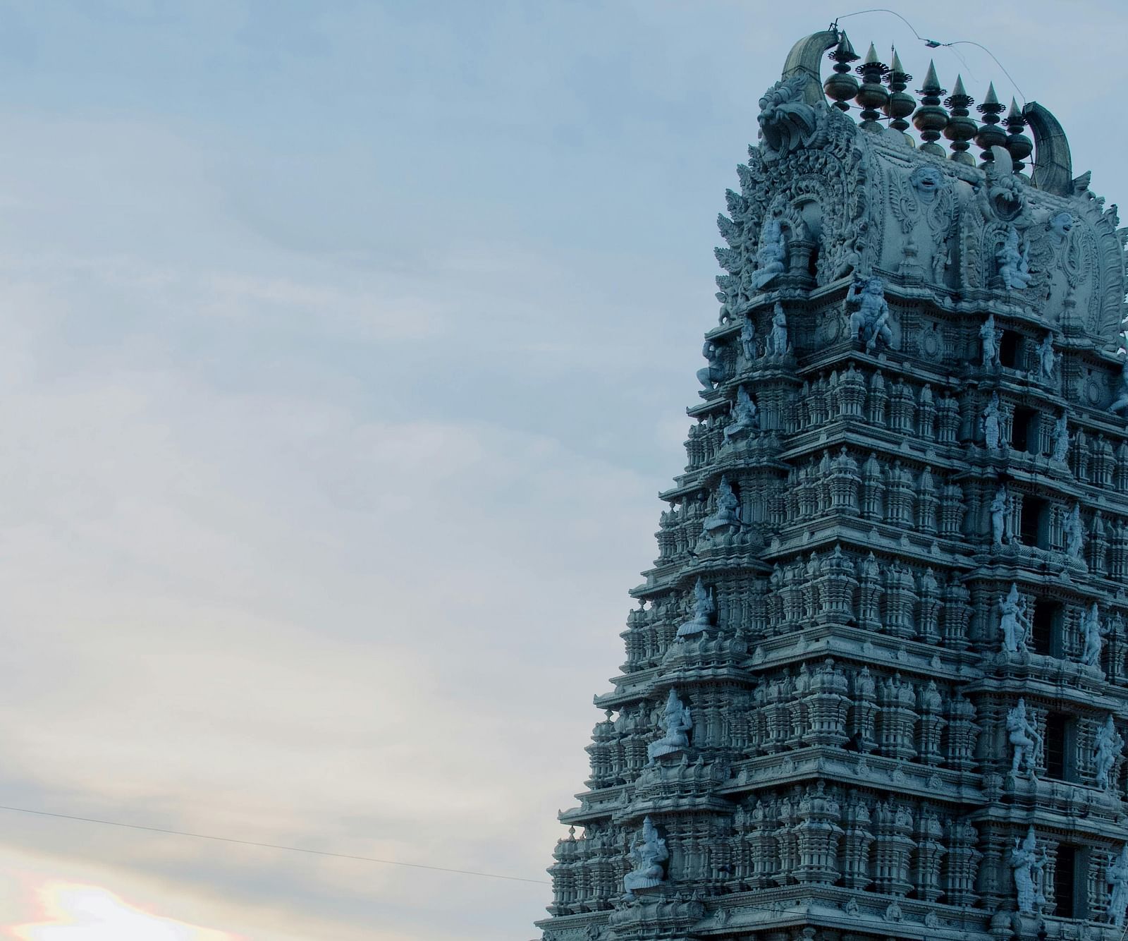 An image of a temple with scenic background