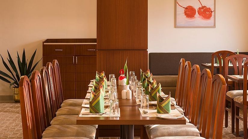 An overview of the seating arrangement inside the best multi-cuisine restaurant in Munnar - Abad Copper Castle.