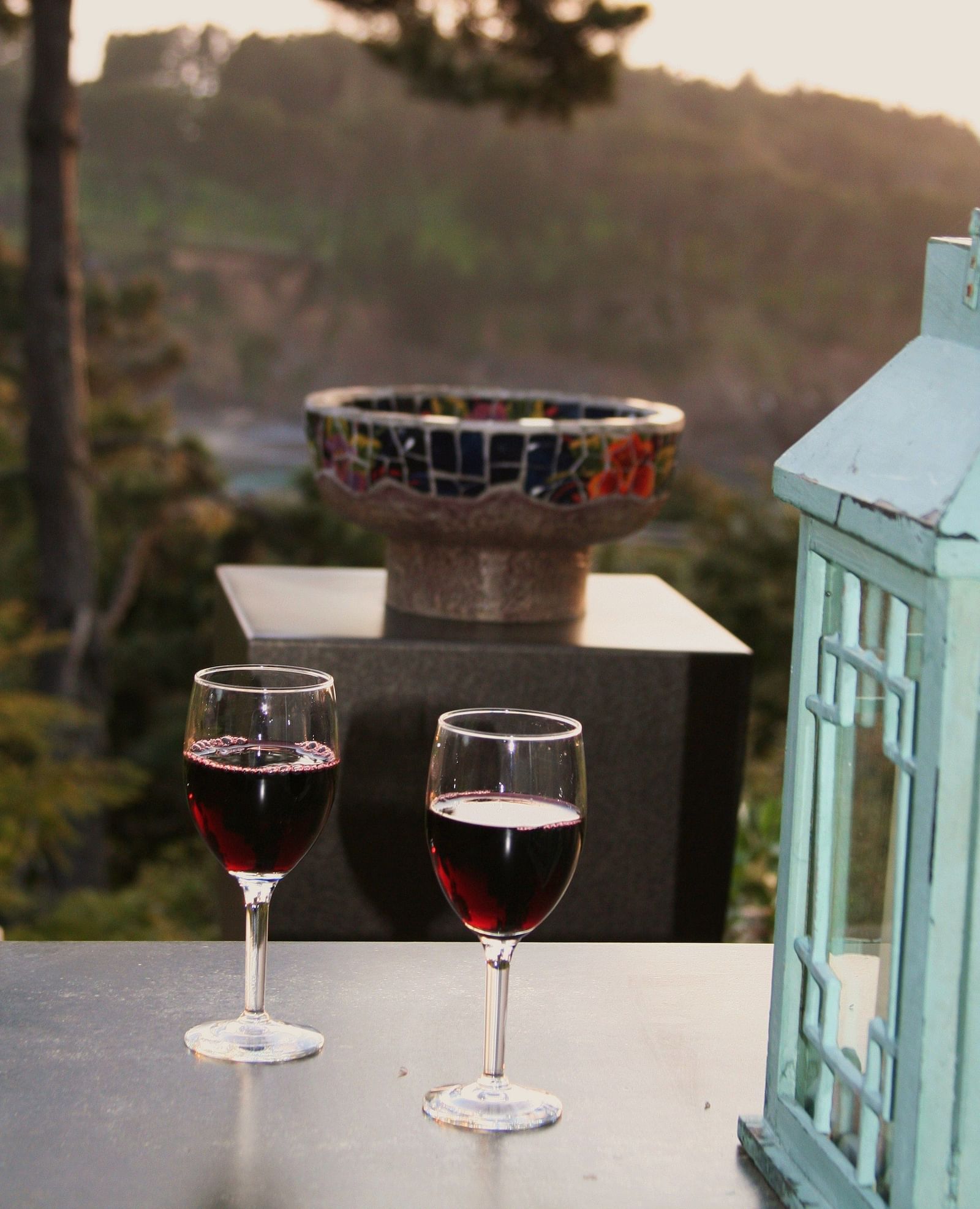 A romantic sunset view with wine glasses on a table - Brewery Gulch Inn & Spa