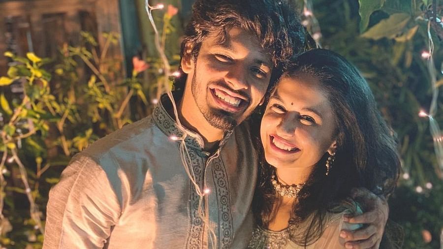 Happy couple in matching silver dress - Rhythm Lonavala