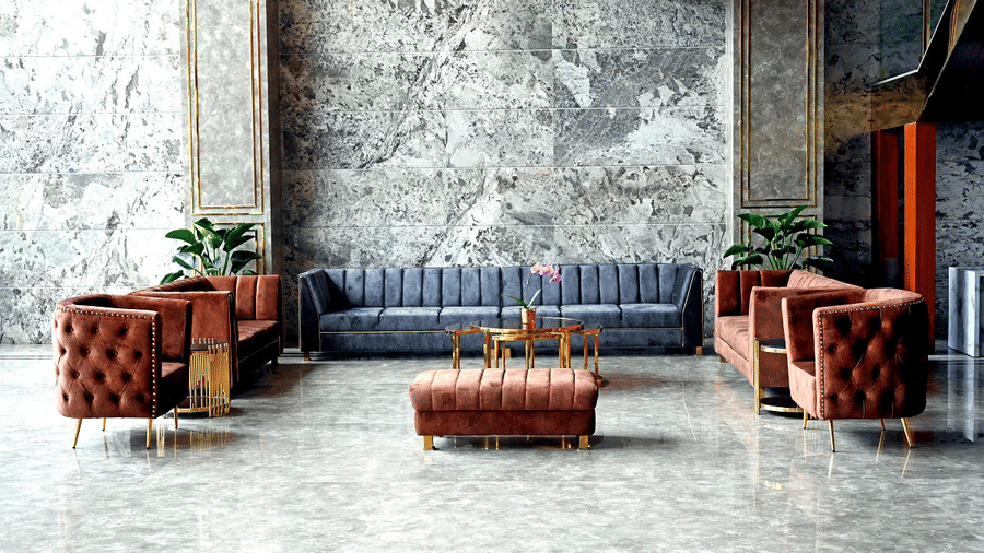 A close up of the seating area in the lobby featuring a modern couch set and potted indoor plants at Leroy Grand, Yeshwanthpur.