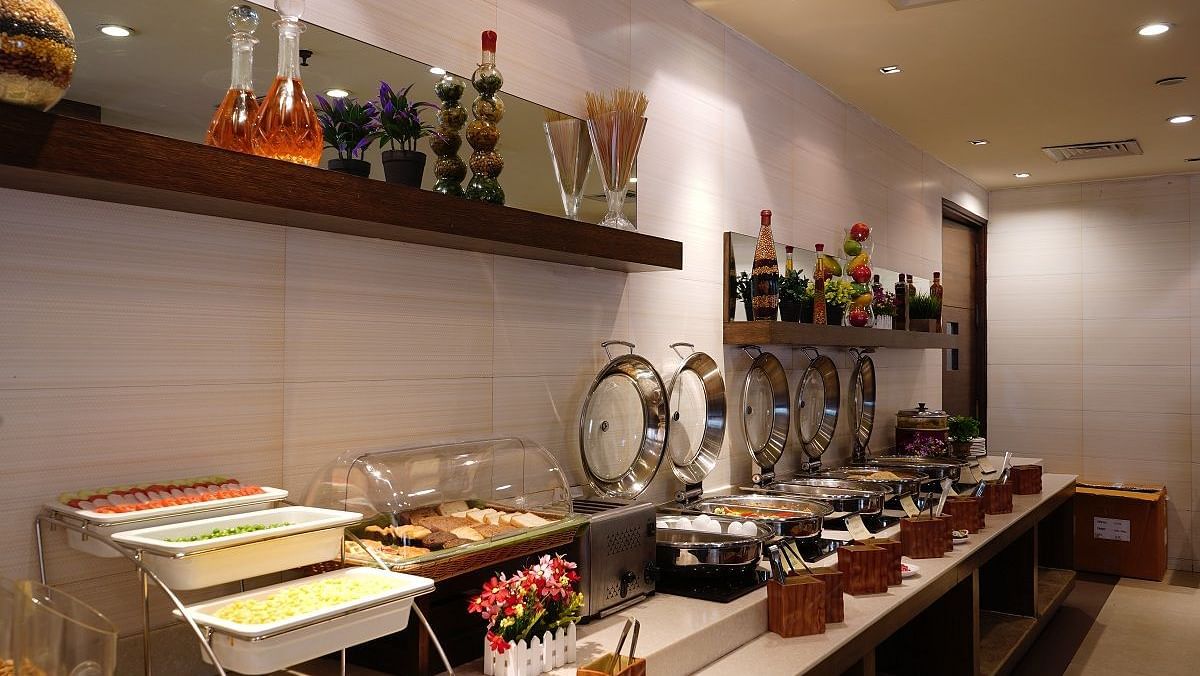 Buffet of food placed on a table at Shervani Nehru Place, New Delhi
