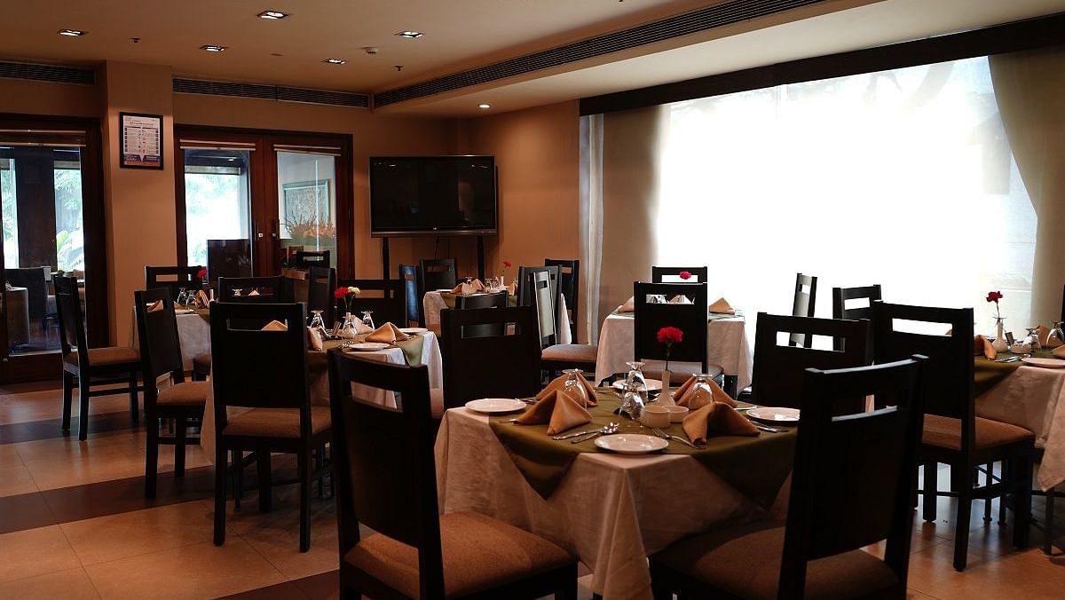 Interior of a cafe featuring elaborate seating arrangements at Shervani Nehru Place, New Delhi