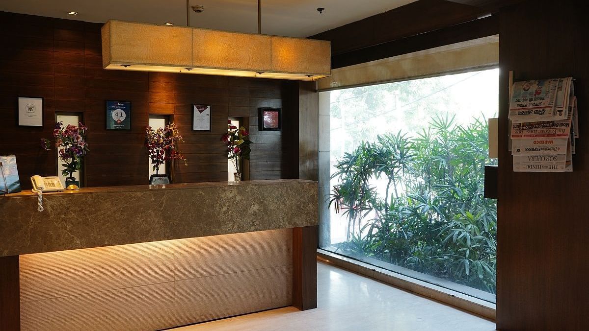 Reception area at Shervani Nehru Place, New Delhi overlooking trees