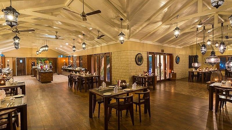 Seating arrangements inside Wildgrass restaurant, our restaurant in Kabini - The serai Kabini