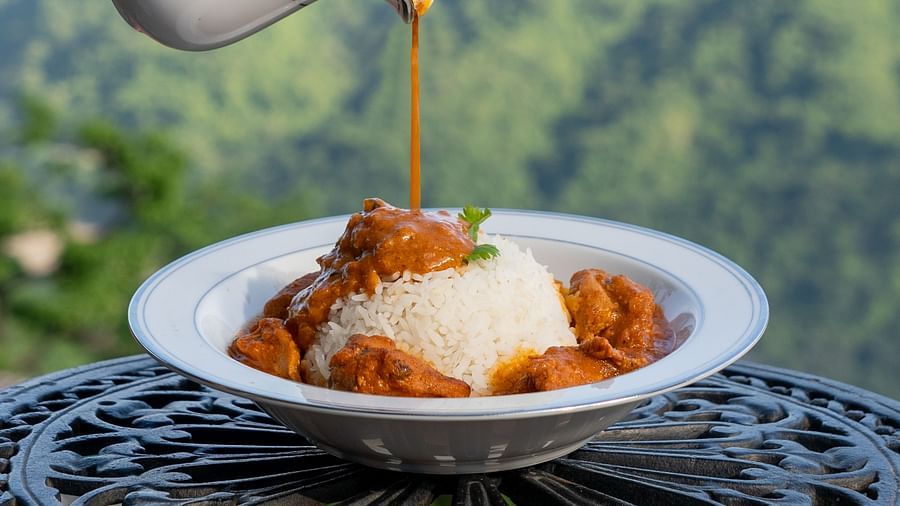 a dish of rice served with a curry - Neer ganga Resorts