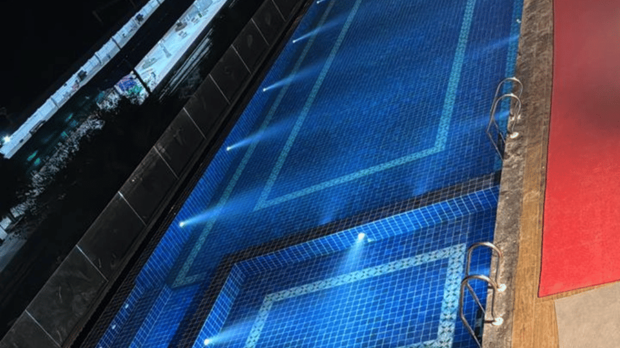 Rooftop swimming pool at Le ROI Digha Hotel, West Bengal, with a separate section for guests to enjoy a relaxing swim and a deck area with lounge chairs.