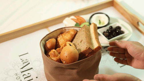 A breakfast tray with pastries being served in-room at La Maison Hotel, Doha.