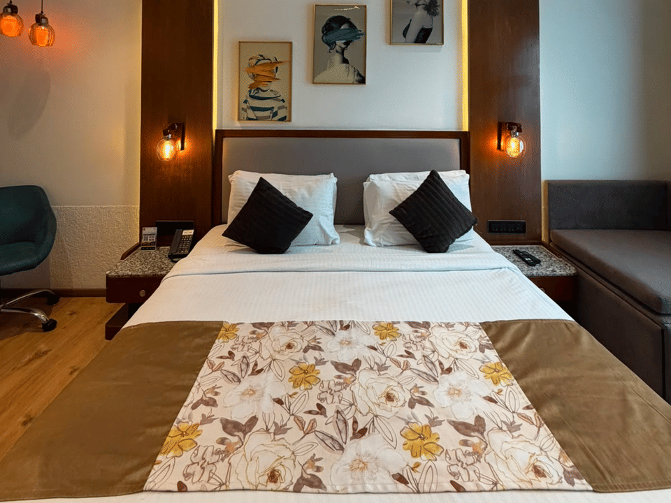 Deluxe Pool Room, King bed with floral bedspread