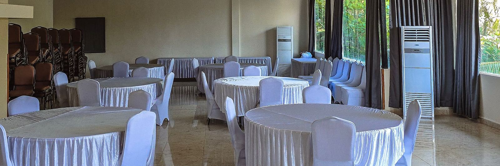 Spacious conference room with elegant round-table seating for meetings or functions at The Verda de Miranda Resort.