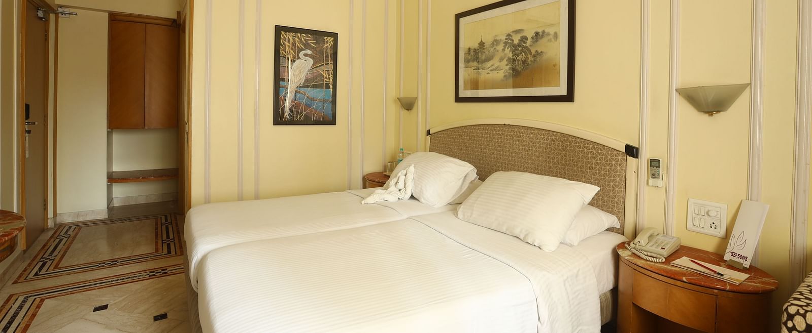 Twin beds in the Standard Room at Regency Hotel, Mumbai.