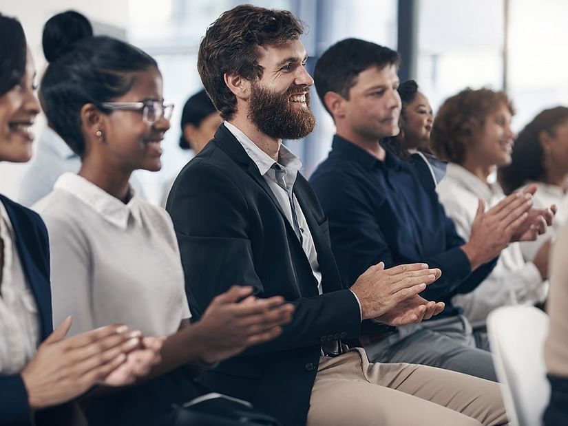 A group of people in business attire attending a seminar - S Hotel Kingston, Jamaica