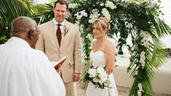 A couple getting married in the presence of the priest at The Soco Hotel, Barbados. 