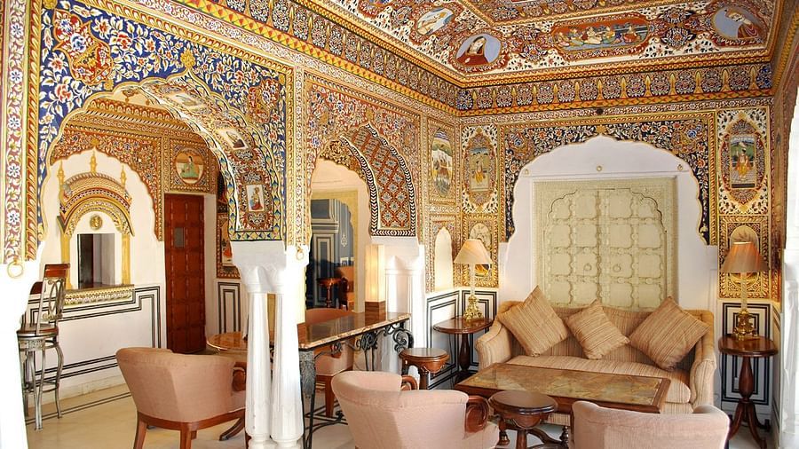 Sileh Khanna Coffee Shop n Bar with a sofa and chairs in a decorated hall  - Hotel Castle Mandawar, Jhunjunu
