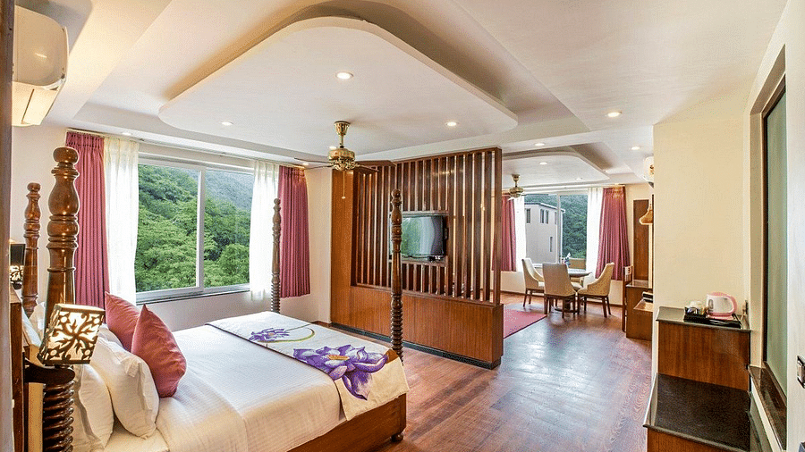 Corner view shot of the Suite with ample of natural light coming from the windows at Regenta Inn DLS.