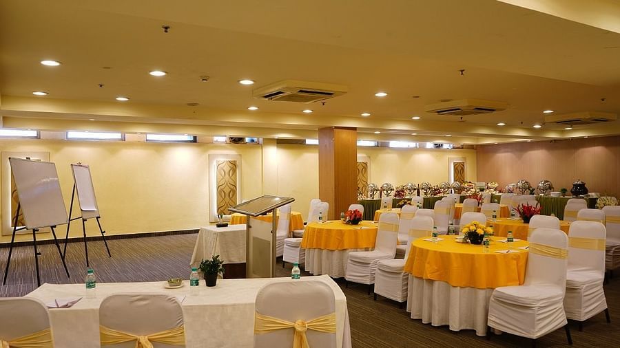 yellow and white chairs at our banquet hall at Shervani Nehru Place, New Delhi 2