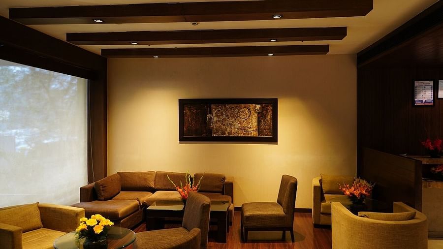 comfy sofa placed in the lounge area of Shervani Nehru Place, New Delhi