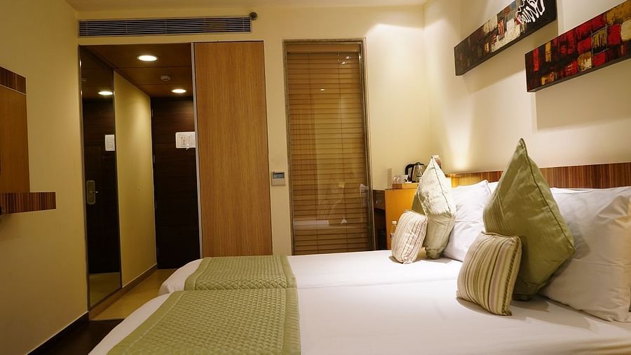 Standard Room furnished with a plush bed at Shervani Nehru Place, New Delhi