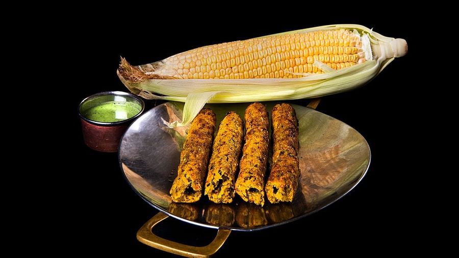 image of makai pyaz ki seekh kababs served with green chutney at the dhaba - The Claridges New Delhi