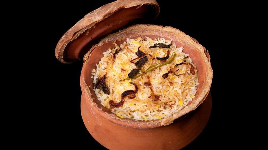 image of a earthen pot with veg biryani 