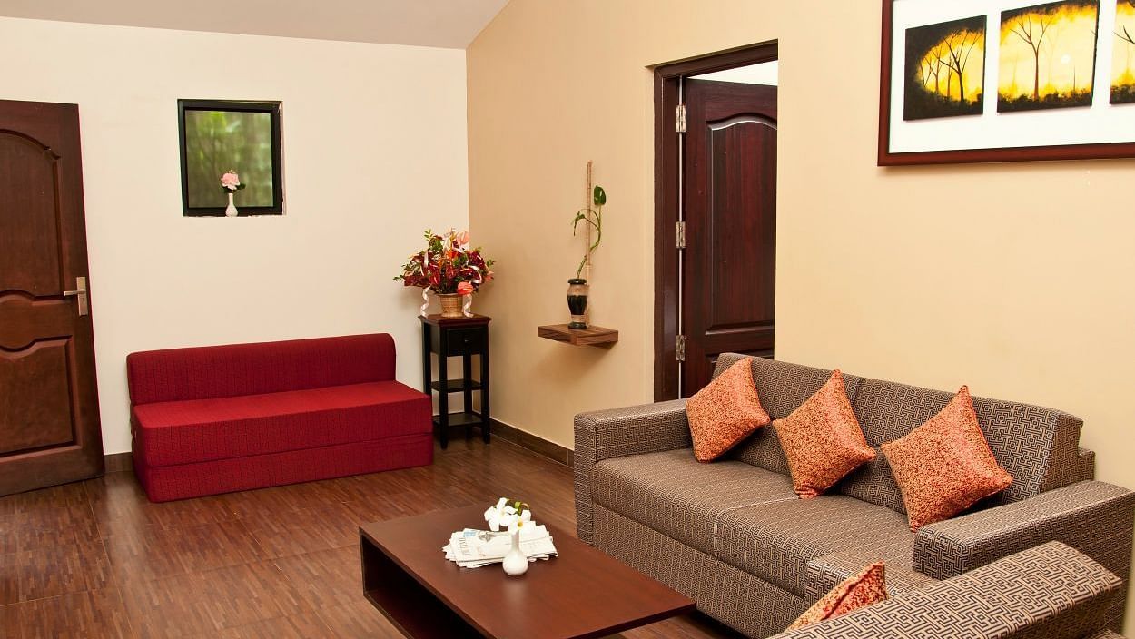 Flora Suite living room with sofa seating and a coffee table