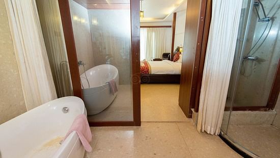 Bathroom with white floor at White Pearl Resort by Rosetum