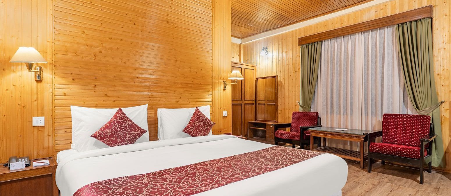 Image of a room with bed and sitting area at at Summit Tashi Ghang Heritage Resort, Pelling