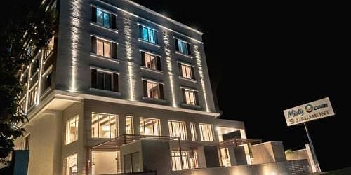 facade image of Misty Ocean, Pondicherry at night 
