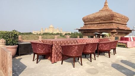 A terrace filled with relaxing furniture at Hanwant Mahal