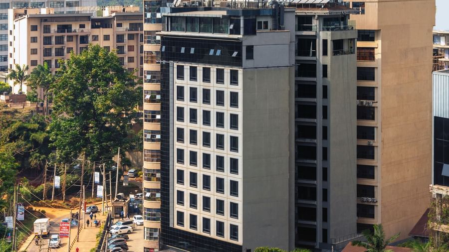Exterior view of Best Western Premier Westlands with city buildings and trees nearby.