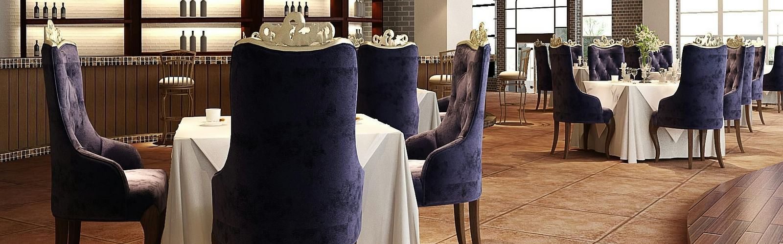 An image of a restaurant displaying seating arrangement with chandeliers hanging