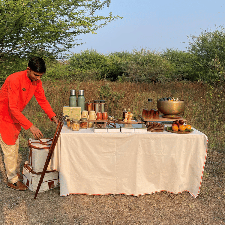 Man setting up tea table