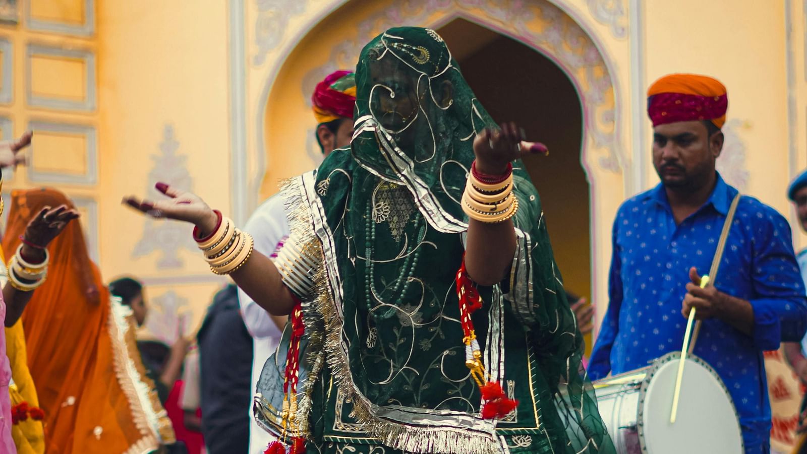 image of a woman in rajasthan dressed in rajasthani traditional attire dancing 
