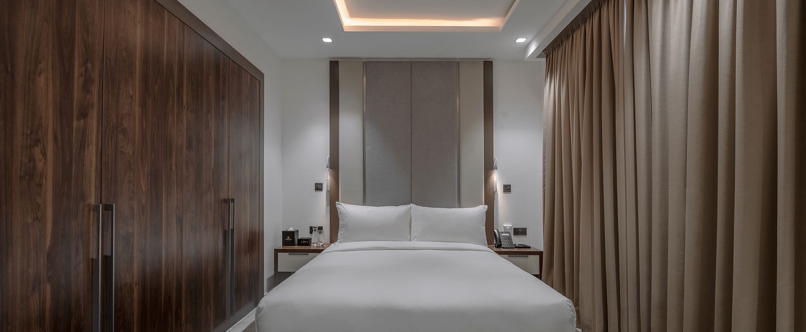 A well-lit Executive Suite with a king size bed. - The Pelican Hotel, Accra