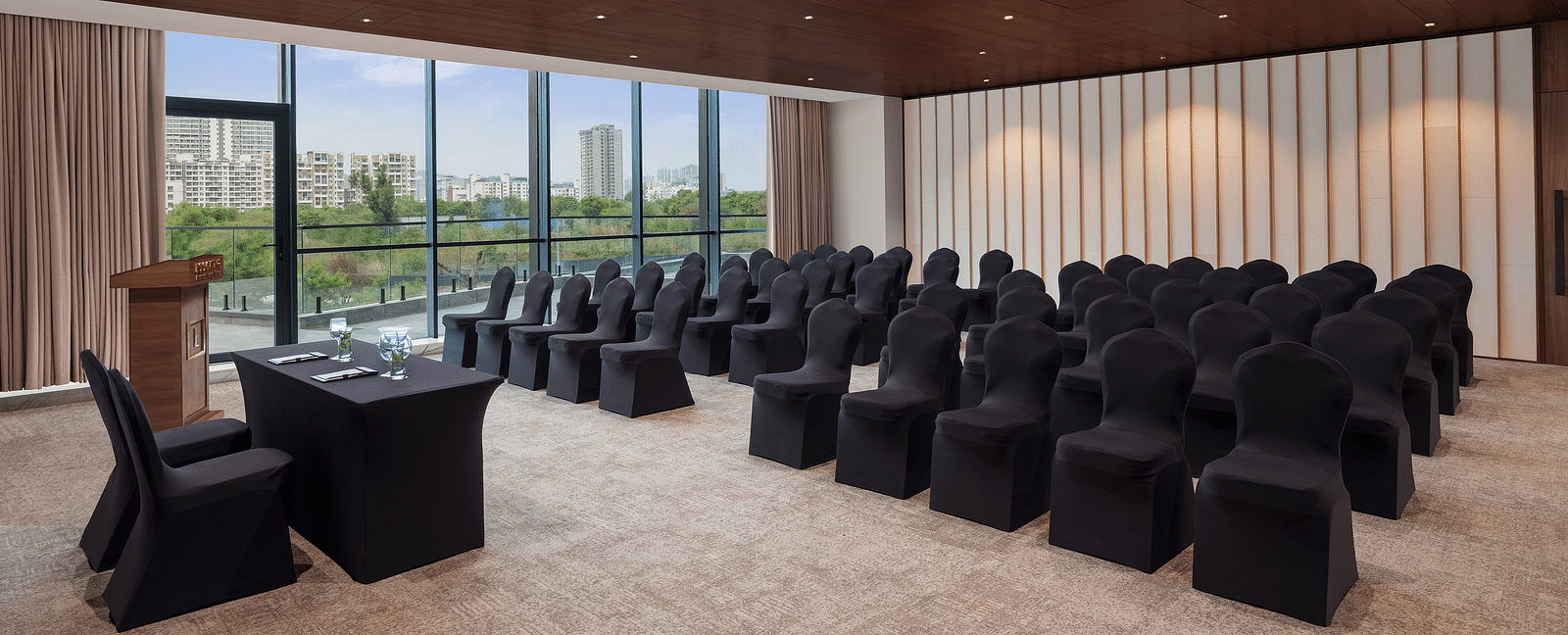 Carnival 1 with comfortable seating facing the stage at Essentia Premiere, Pune.