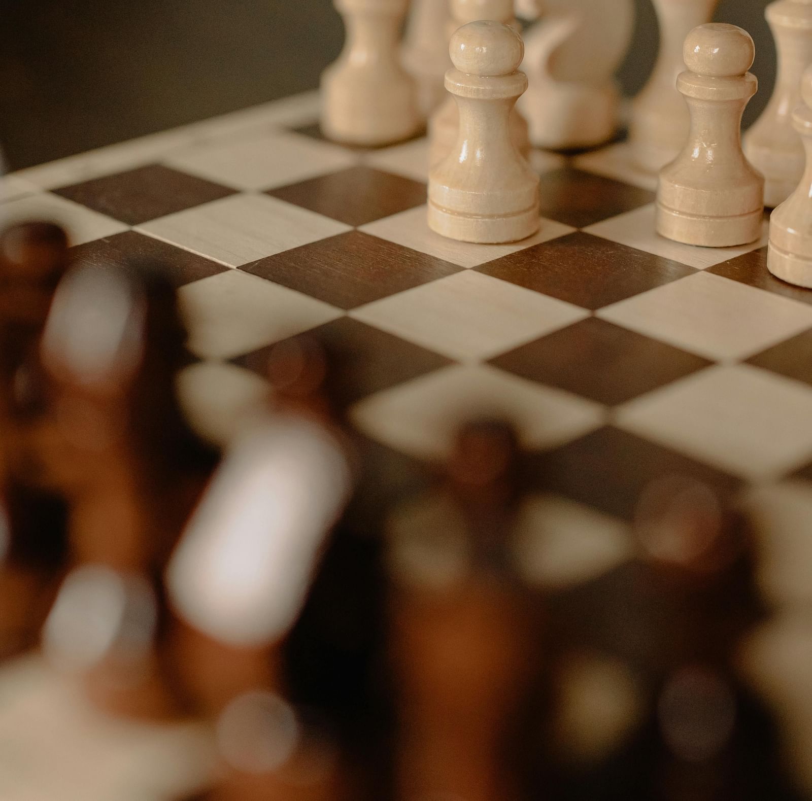 Chess pieces placed on a chess board.