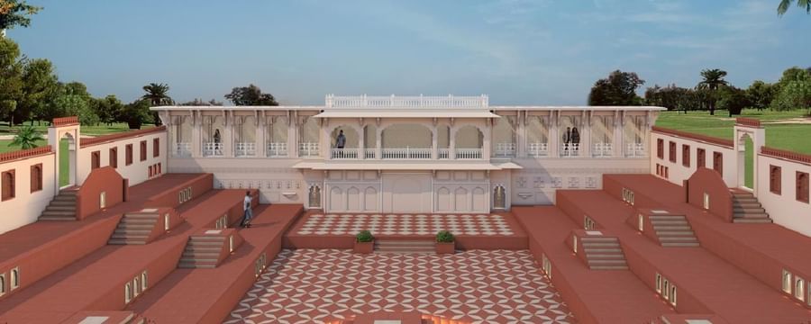 Umaid Palace courtyard with patterned floor, red steps, and central building.