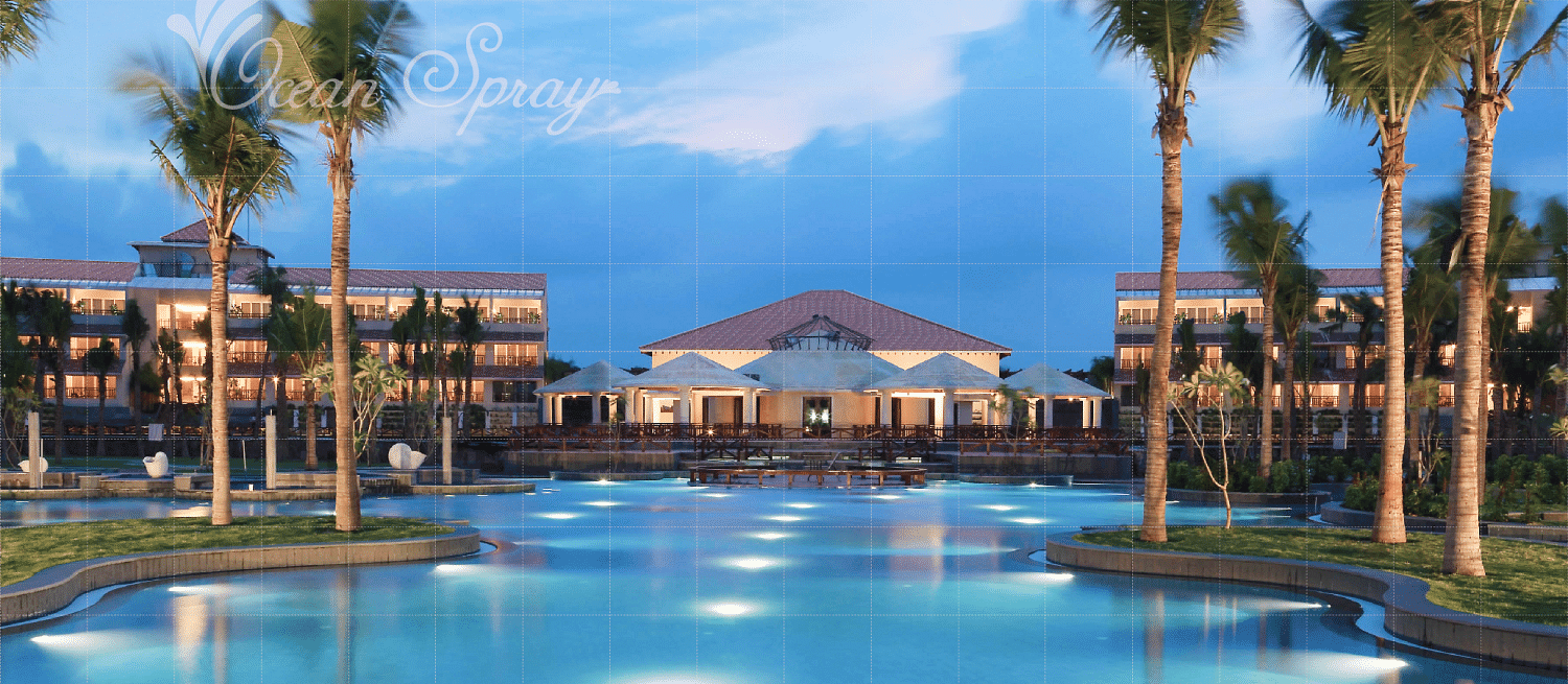 swimming pool surrounded by villa and tree at Ocean Spray, Puducherry.