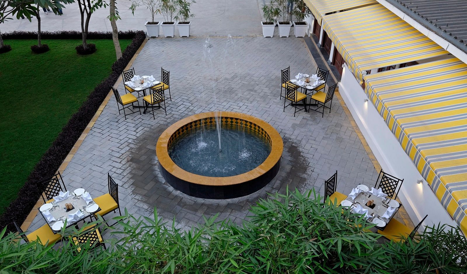 aerial view of seating arrangements with a fountain at its centre