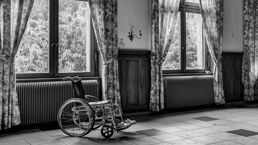 grayscale-photo-of-wheelchair-927690