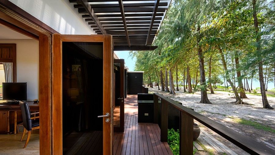 image of the porch open to the sea views and a tropical forest - one bedroom private pool beachfront villa